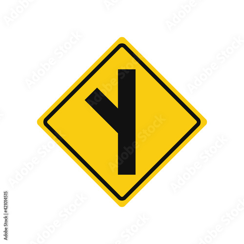 Rhomboid traffic signal in yellow and black, isolated on white background. Warning of side road on the left at a acute angle