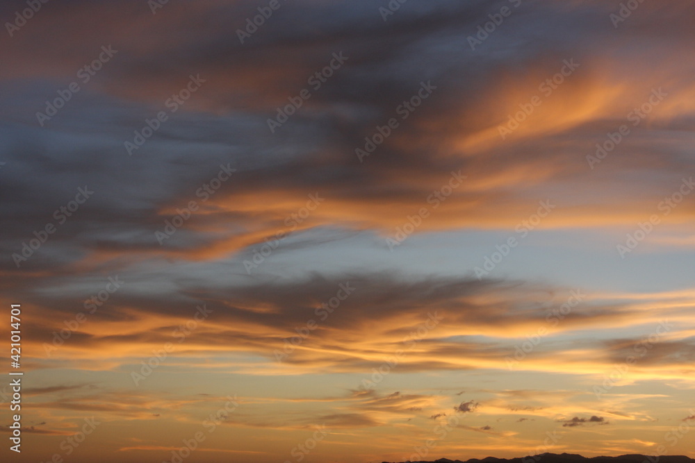 Pink and orange clouds in the evening sky, natural background