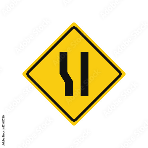Rhomboid traffic signal in yellow and black, isolated on white background. Warning of wide road ahead on left side