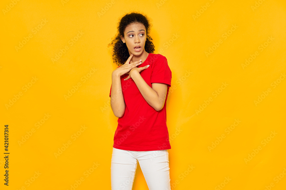 The surprised woman looks away and gestures with her hands The surprised woman looks away and gestures with her hands