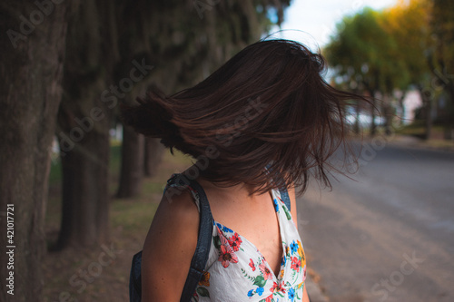 Woman moving hair
