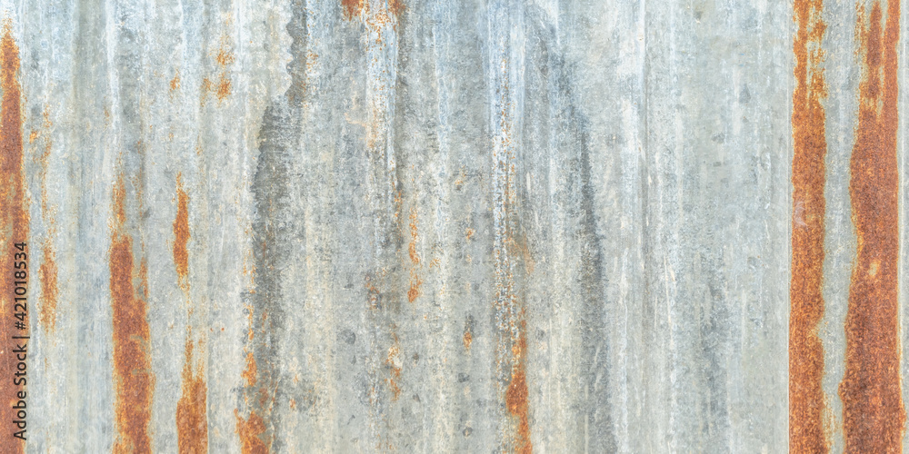 Corrugated galvanized rusty metal sheet background with old aged rust texture on zinc tin or iron steel grunge wall roof panel for vintage wallpaper Corrugated galvanized rusty metal sheet background with old aged rust texture on zinc tin or iron steel grunge wall roof panel for vintage wallpaper