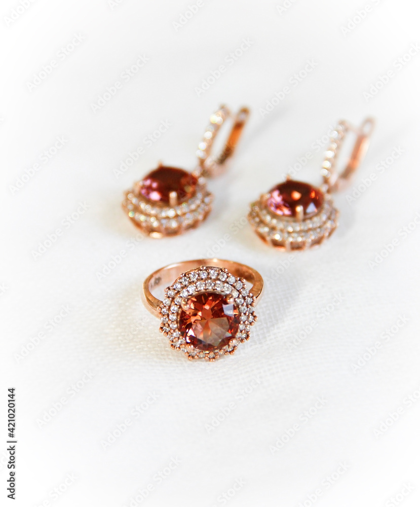 women's gold jewelry ring and earrings with precious stones women's gold jewelry ring and earrings with precious stones