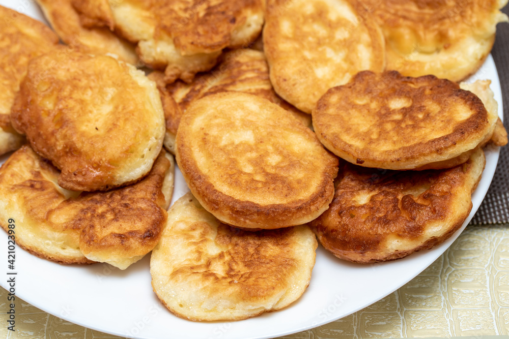 Fried donuts on a plate, cooking.