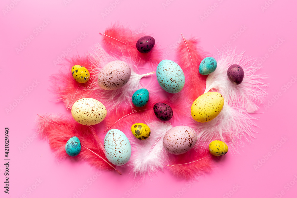 Happy Easter card with colorful eggs and feather. Overhead view Happy Easter card with colorful eggs and feather. Overhead view