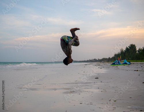 Young Attractive Muscular and Strong Athletic Black African Man at the White Sand Beach Training Body Calisthenics