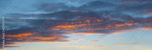 Colorful sky with clouds at sunset, panoramic nature background and web banner © Delphotostock