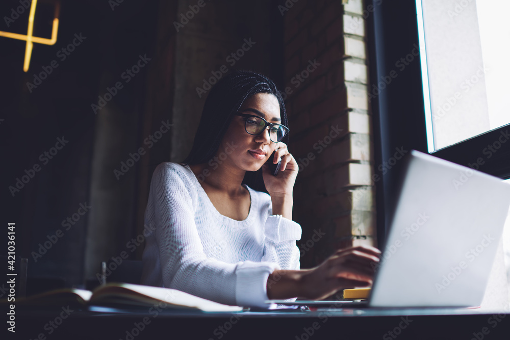 Focused woman with gadgets in cafe Focused woman with gadgets in cafe