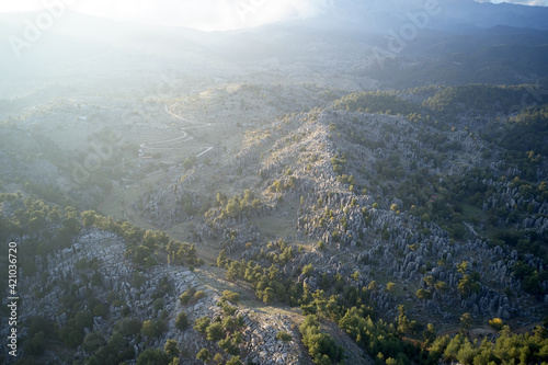 Aerial panoramic view of foggy morning mountain scene.