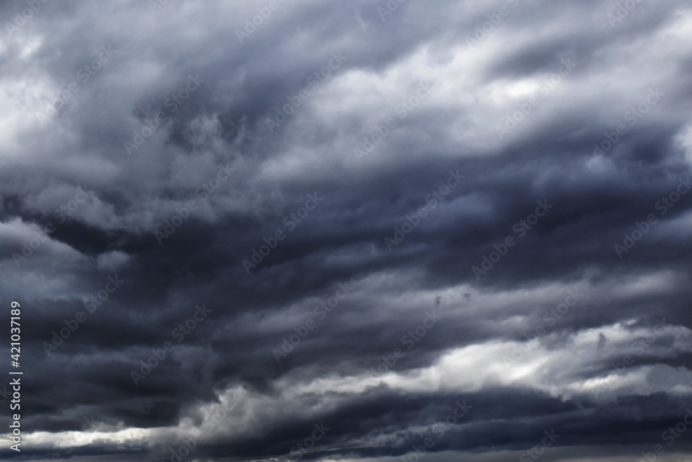 Stormy dark cloudy sky background.  Rainy season concept.  Blurred photo of sky.