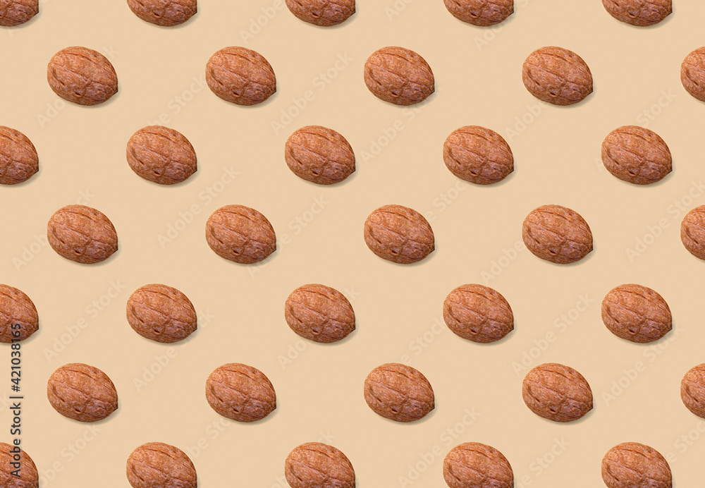 background of nuts, pattern of nuts on a beige background background of nuts, pattern of nuts on a beige background