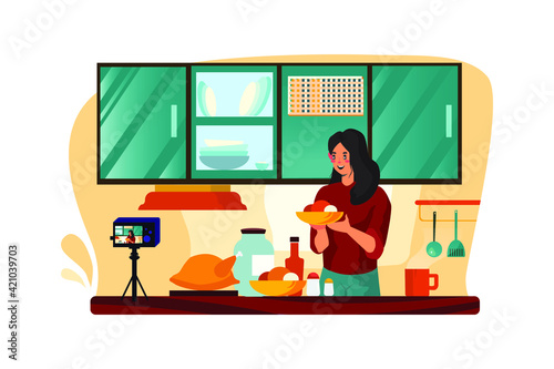 Young female blogger vloger and online influencer recording video content on healthy food