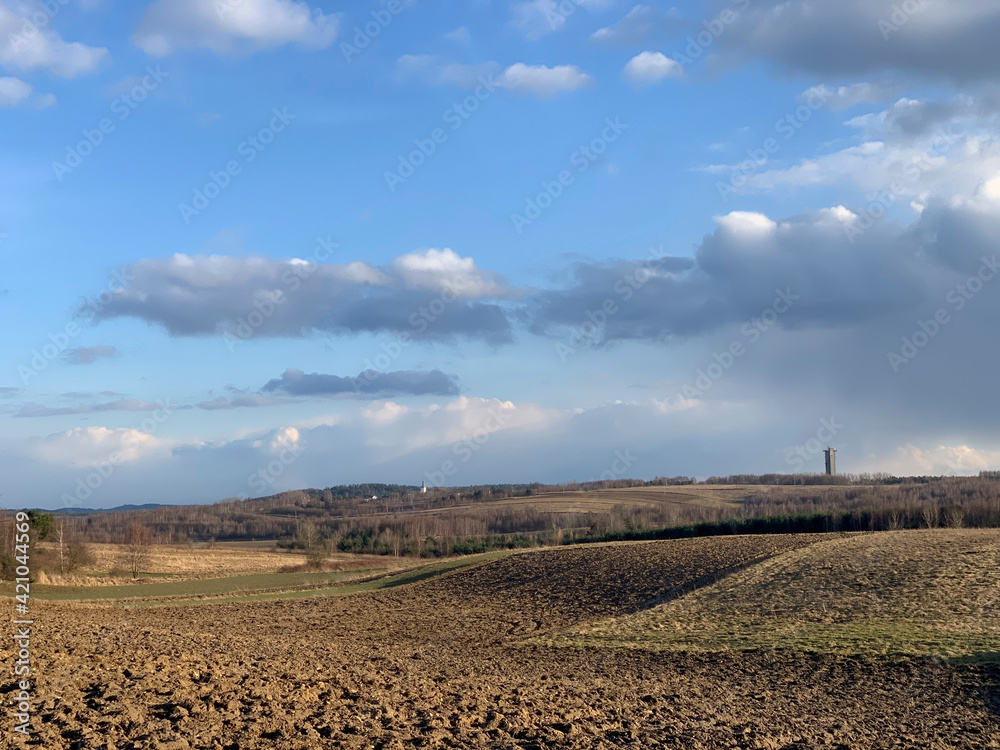 Countryside with plowed fields in early spring, Poland