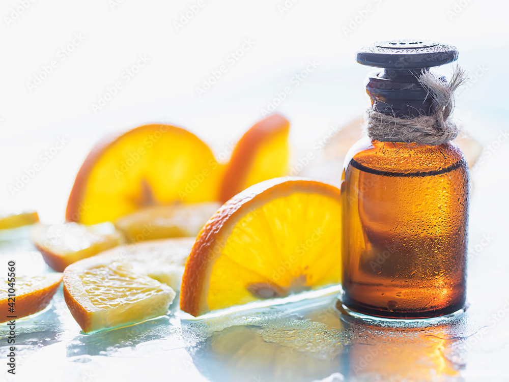 Vitamin c serum and fresh citrus fruits. Citrus essential oil. Natural cosmetics concept. SPA cosmetics with herbal ingredients. Vitamin c serum and fresh citrus fruits. Citrus essential oil. Natural cosmetics concept. SPA cosmetics with herbal ingredients.