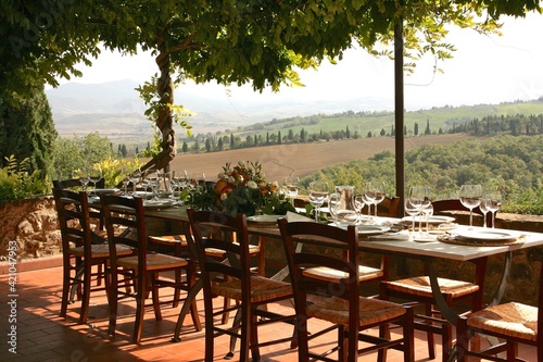 Table set for al fresco dinner with a view. Tuscany, Italy 