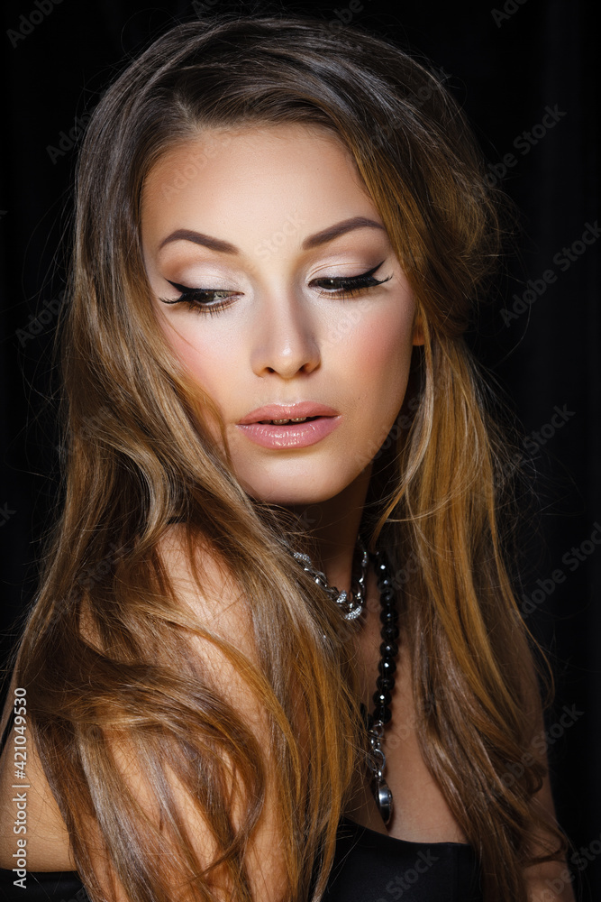 Natural beauty, skincare and haircare. Portrait of beautiful female model with clean face isolated on black background. Young woman shows healthy sensitive skin after using cosmetics and makeup Natural beauty, skincare and haircare. Portrait of beautiful female model with clean face isolated on black background. Young woman shows healthy sensitive skin after using cosmetics and makeup