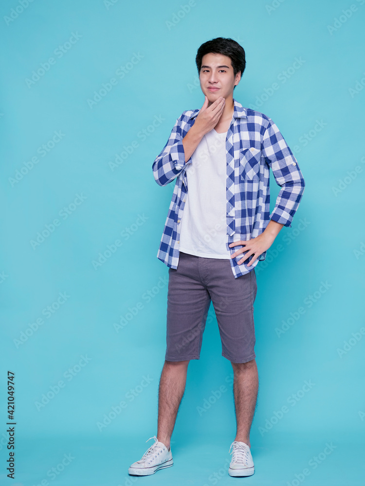 Handsome man posing on blue background Handsome man posing on blue background