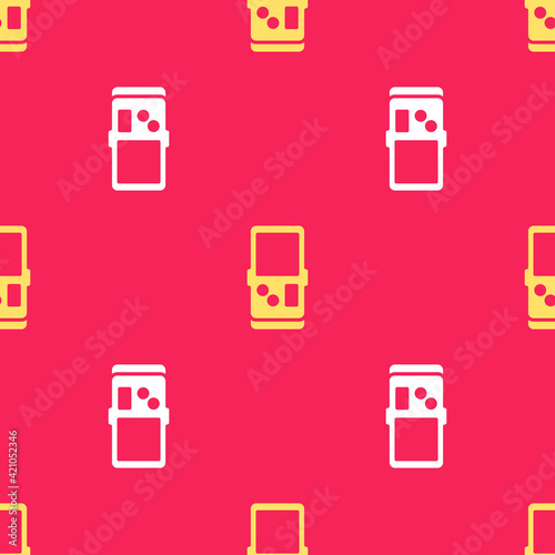 Yellow Portable tetris electronic game icon isolated seamless pattern on red background. Vintage style pocket brick game. Interactive playing device. Vector