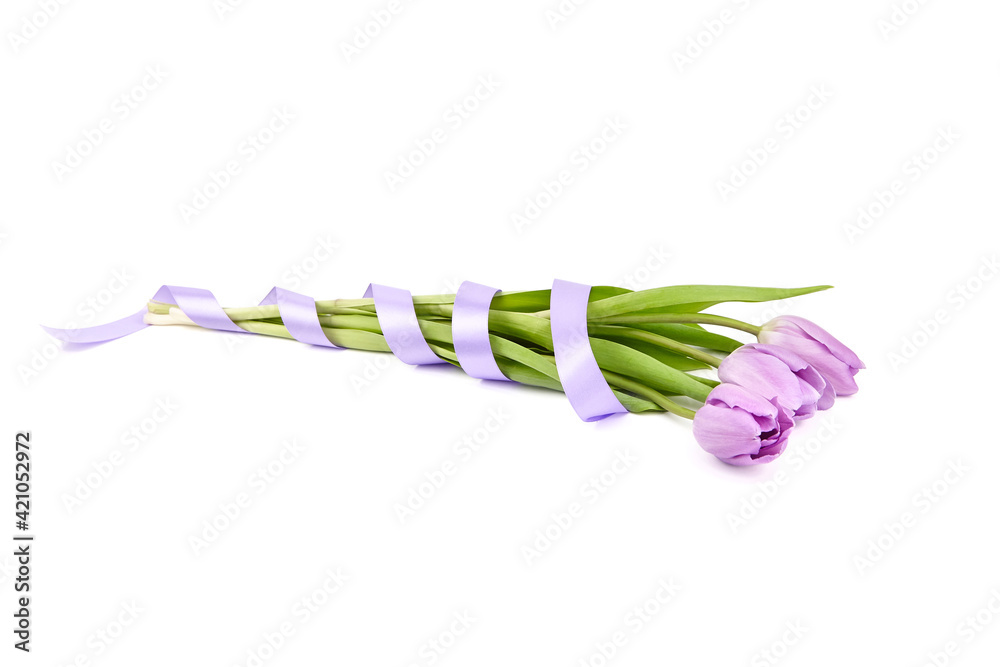 Bouquet of tulips decorated with a ribbon. Purple spring tulip flowers isolated on white Bouquet of tulips decorated with a ribbon. Purple spring tulip flowers isolated on white