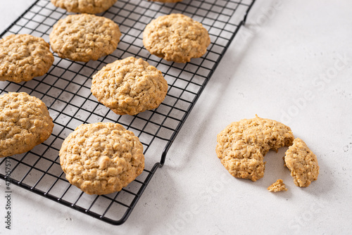 Healthy oatmeal cookies with nuts on white background. Bakery menu, recipe. Side view