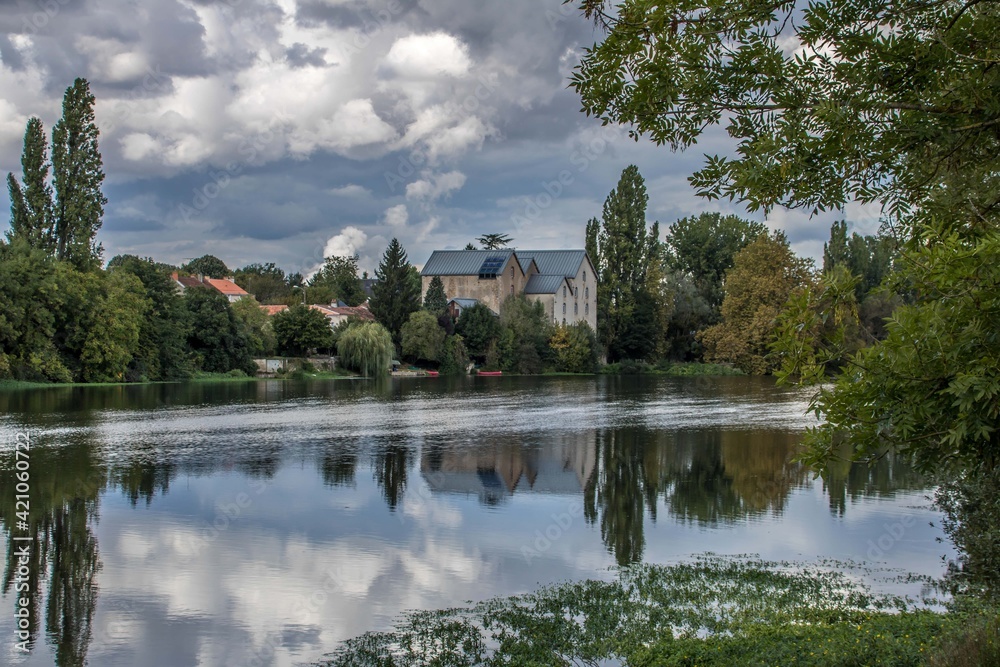 reflections in La Vienne River in Lussac France