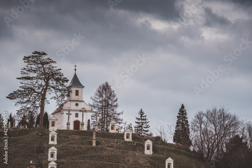 Small chapel with stormy clouds photo