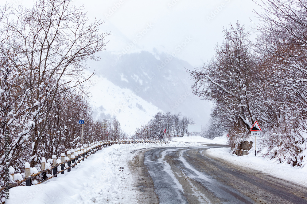 Fototapeta premium Road to Gudauri resort in winter. Travel