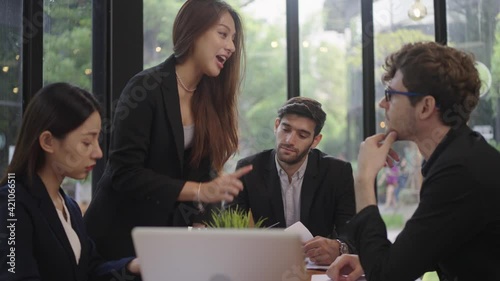 Group of young business people meeting in office.