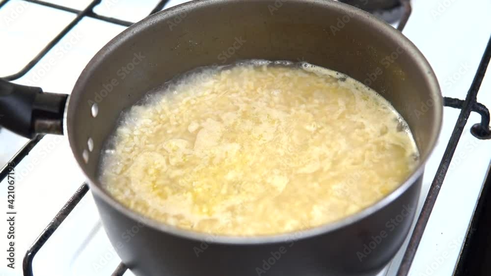cooking rice in a grey pot cooking rice in a grey pot