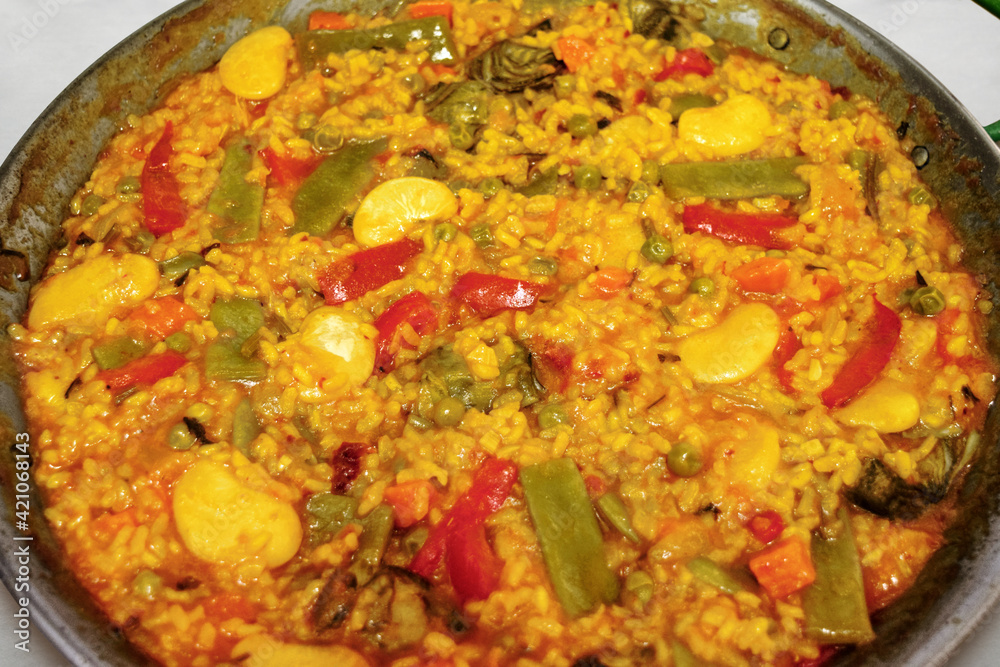 Vegetable paella. Typical valencian dish, vegan version Vegetable paella. Typical valencian dish, vegan version