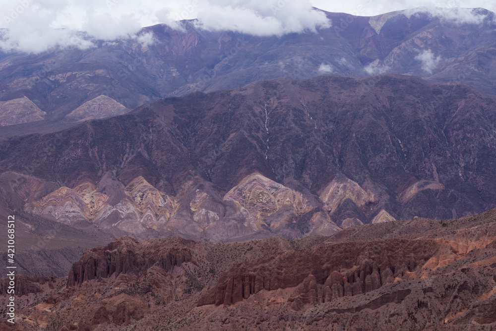 The steep canyon. View of majestica Humahuaca ravine. The cliffs, rock and sandstone formations, desert and precipice, high in the Andes mountains.