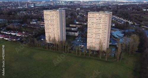 Aerial footage view of high rise tower blocks, flats built in the city of Glasgow to accommodate the increasing population, council housing crisis,