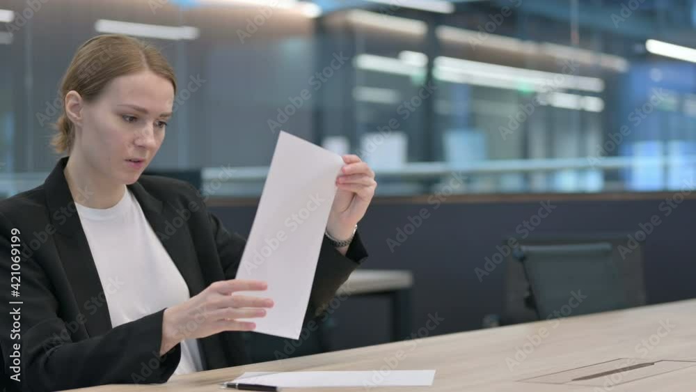 Businesswoman Trying to Write on Paper in Office Businesswoman Trying to Write on Paper in Office