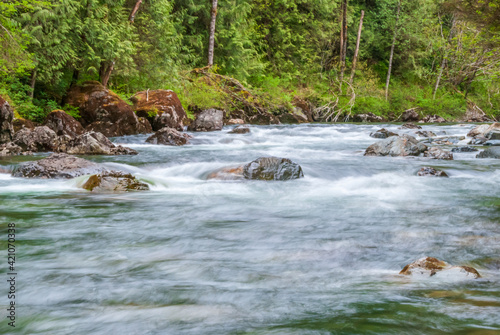 Majestic mountain river in slow motion with rocky background in Vancouver, Canada.