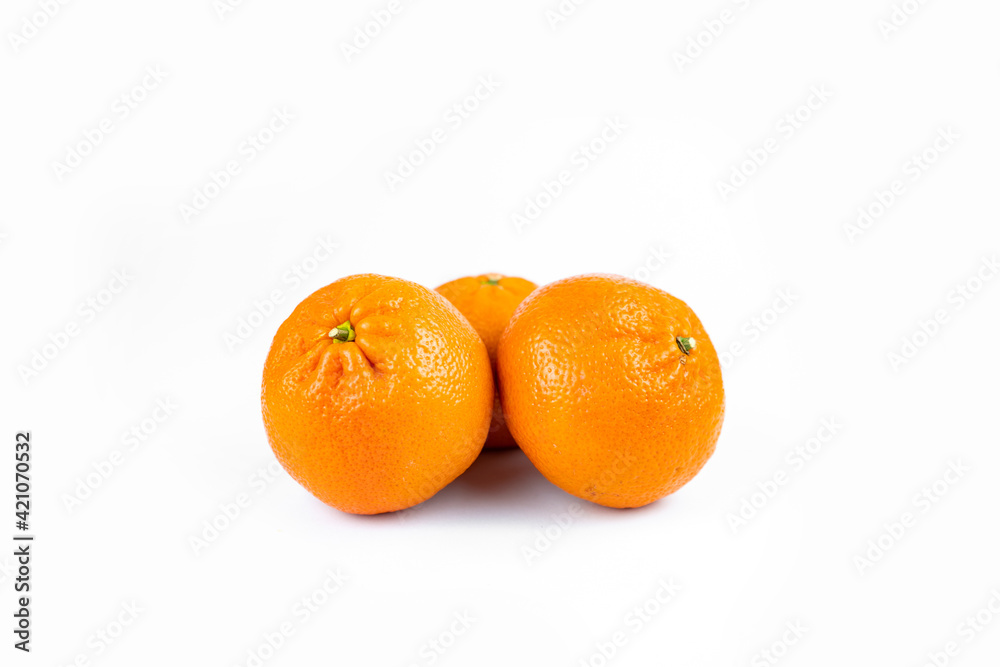 Ripe fresh juicy tangerines with leaves on white background Ripe fresh juicy tangerines with leaves on white background