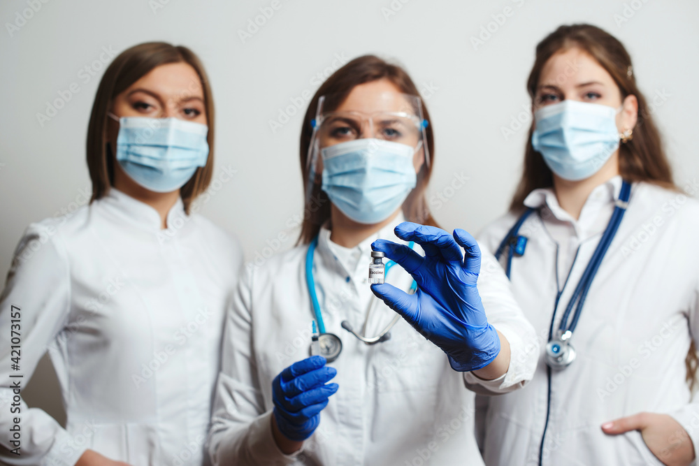 Group of doctors with face masks ready to fight coronavirus. Start COVID-19 vaccination. Group of doctors with face masks ready to fight coronavirus. Start COVID-19 vaccination.