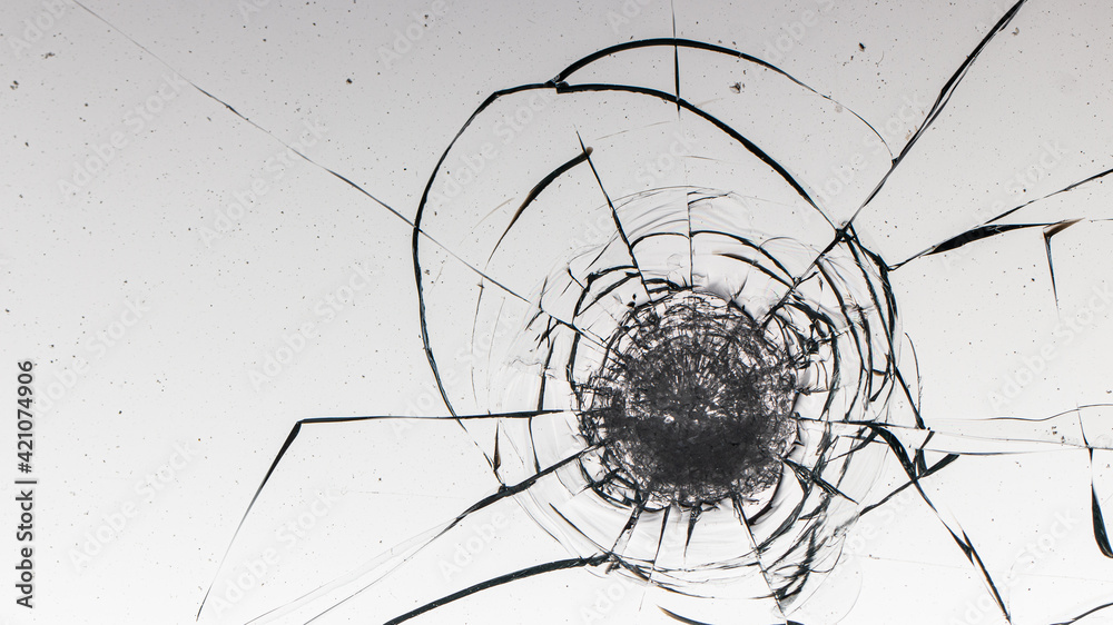 Cracks on the glass on a white background.