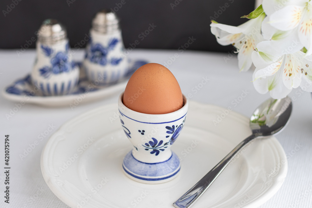 Boiled egg on white and blue Delft porcelain Boiled egg on white and blue Delft porcelain