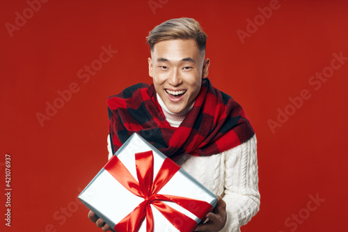 Cute guy with a gift box with a dead camera 