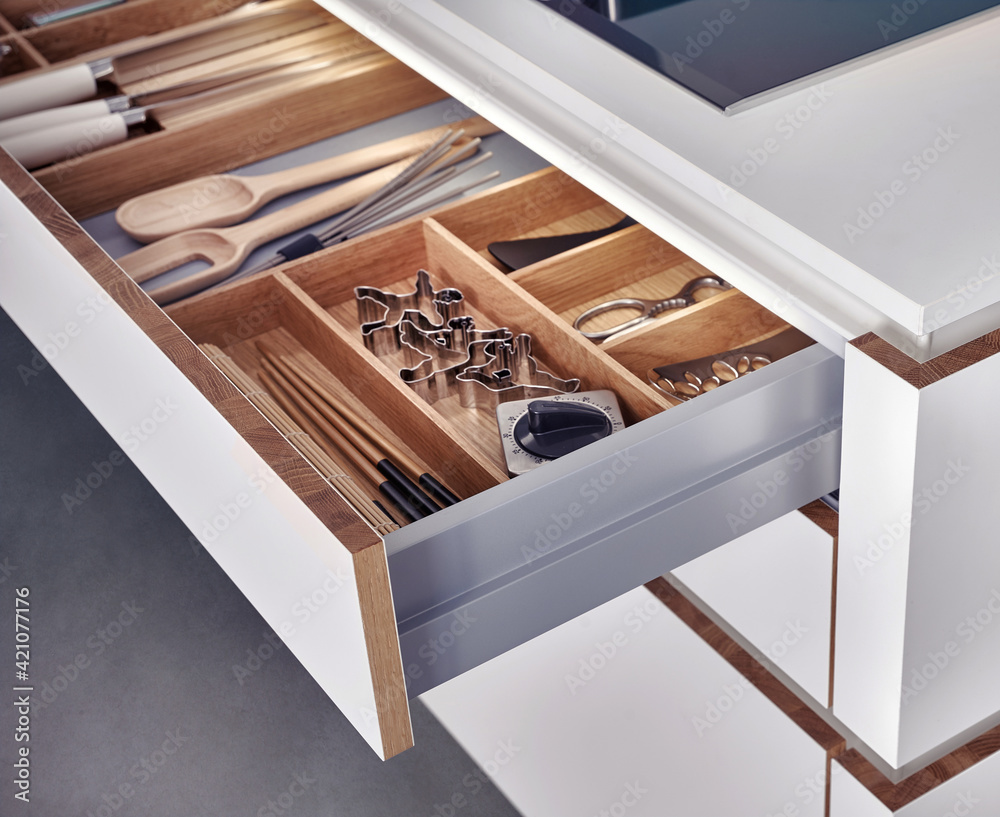 Modern kitchen, Open drawers, Set of cutlery trays in kitchen