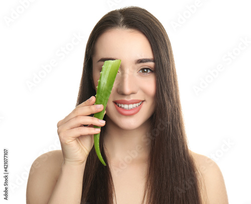 Young woman with aloe vera leaf on white background