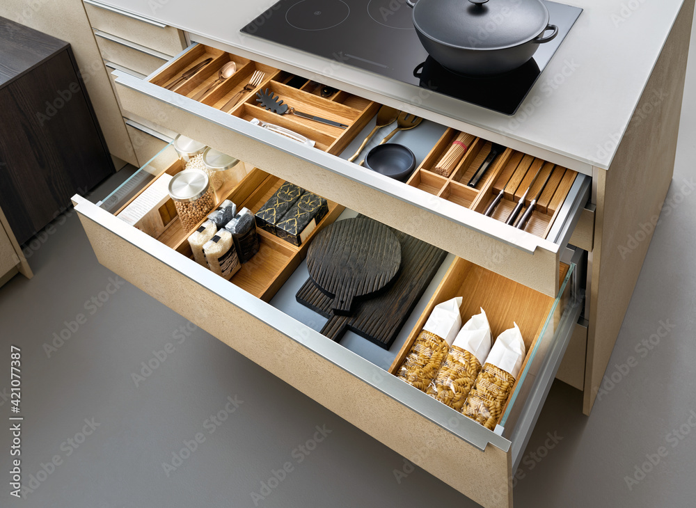 Modern kitchen, Open drawers, Set of cutlery trays in kitchen