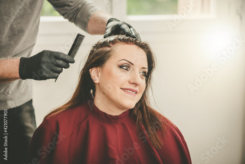 Hairdresser coloring hair