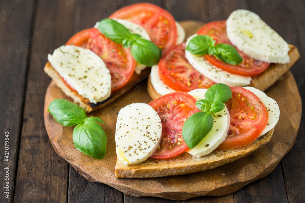 Healthy homemade sandwich with tomato, mozzarella and basil
