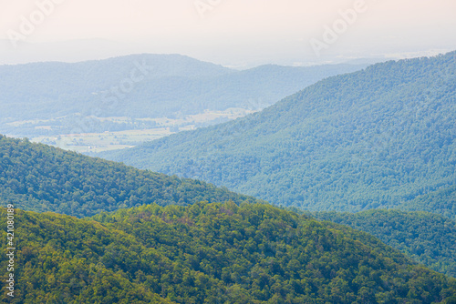 Aerial high angle view of Shenandoah Blue Ridge appalachian mountains, rolling hills from skyline drive overlook in Virginia with Stanley city rural village town © Andriy Blokhin