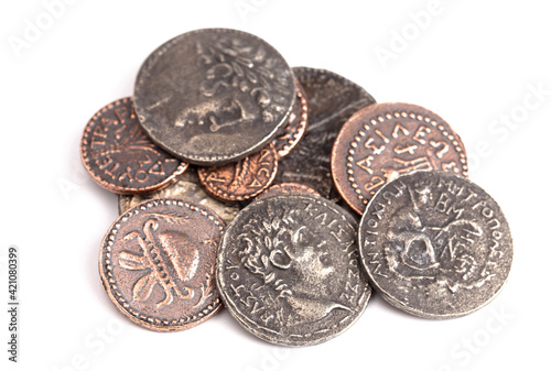 Pile of Ancient Roman Coin Replicas Isolated on a White Background