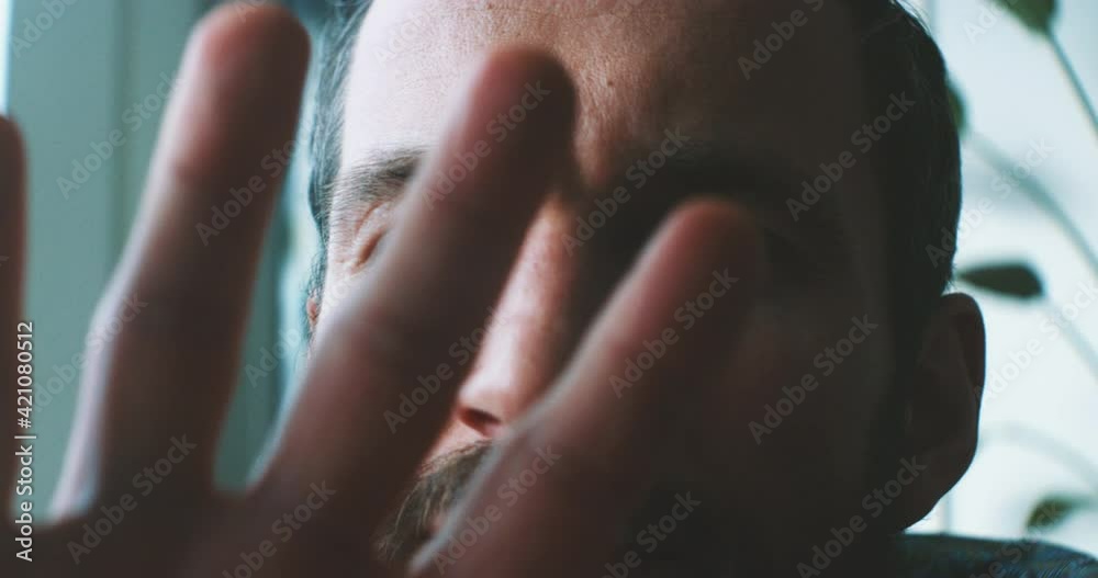 person looking through his hand person looking through his hand