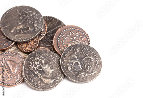 Pile of Ancient Roman Coin Replicas Isolated on a White Background