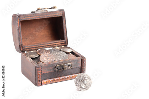 Treasure Chest Filled with Ancient Coins on a White Background