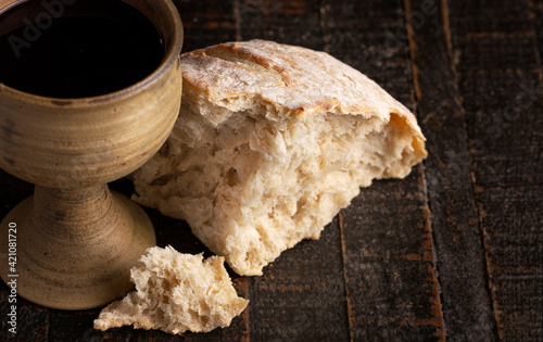 Foto Sacrament of Holy Communion  on a Dark Wooden Table